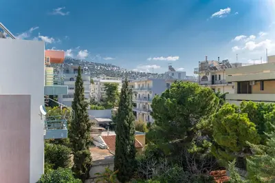 a view of a city with trees and buildings at Artsy Spacious Cozy Apartment in Glyfada Center in Athens
