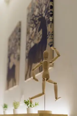 a wooden toy man running on a faucet at Modern & Stylish 1 BDR Apartment in Athens