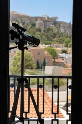 a camera on a tripod on top of a balcony at Esse Athens in Athens