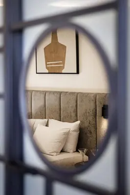 a view of a couch through a window at Esse Athens in Athens