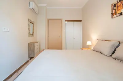 a large white bedroom with a large bed at Rovertou Galli 3-5 by Athens Concept Residences in Athens