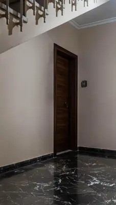 an empty room with a door and a marble floor at Rovertou Galli 3-5 by Athens Concept Residences in Athens