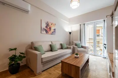 a living room with a couch and a coffee table at Rovertou Galli 3-5 by Athens Concept Residences in Athens