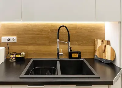 a kitchen counter with a sink and a guitar at Apartment near City Center in Athens