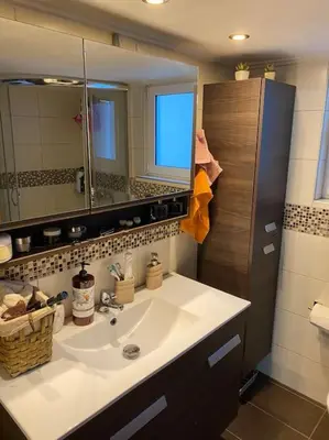 a bathroom with a sink and a mirror at House close to the port Piraeus and metro station in Piraeus