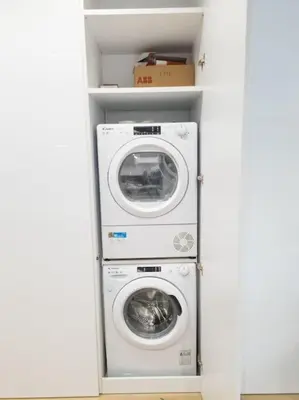 a laundry room with a washer and dryer at Azalea Suite - 5 min drive to Piraeus Port in Piraeus