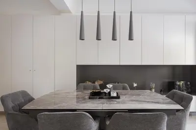 a dining room with a marble table and chairs at Vouliagmeni Stylish Apartment in Athens