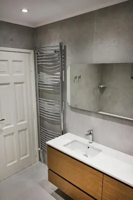 a bathroom with a sink and a mirror and a shower at Athens Riviera Villa in Anavissos
