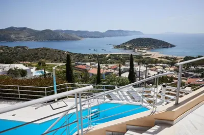 a view from the balcony of a house with a swimming pool at Athens Riviera Villa in Anavissos