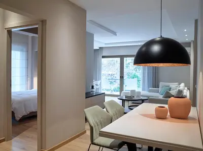 a living room with a couch and a table at Athenian Riviera Exclusive flat , Athens Greece in Athens