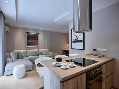a kitchen and living room with a couch and a table at Athenian Riviera Exclusive flat , Athens Greece in Athens