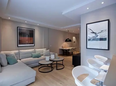 a living room with a white couch and chairs at Athenian Riviera Exclusive flat , Athens Greece in Athens