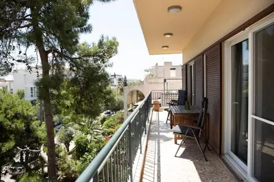 an apartment balcony with a view of the city at Spacious Glyfada Golf 4BR -Near Beach + Shops in Athens