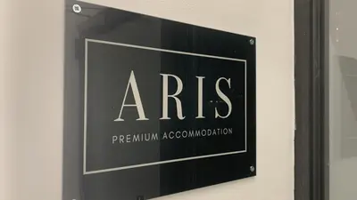 a sign on a wall that reads arris at ARIS Ampelokipoi in Athens