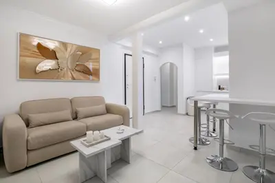 a living room with a couch and a table at Acropolis Museum Apartment by A&A Residences in Athens