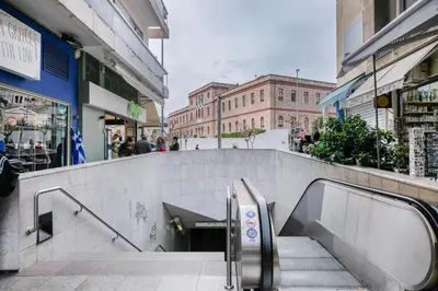 a set of stairs in a city with buildings at Acropolis Museum Apartment by A&A Residences in Athens