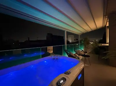 a large swimming pool on a balcony at night at BlueMotion - SensaBlu #2 in Piraeus