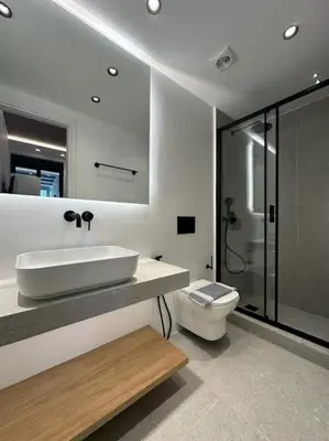 a bathroom with a sink and a toilet at BlueMotion - SensaBlu #2 in Piraeus