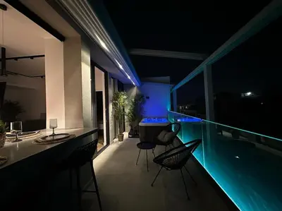 a house with a swimming pool at night at BlueMotion - SensaBlu #2 in Piraeus