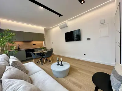 a living room with a white couch and a table at BlueMotion - SensaBlu in Piraeus
