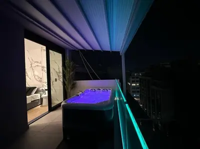 a room with a purple bed on a balcony at BlueMotion - SensaBlu in Piraeus