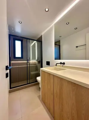 a bathroom with a sink and a shower and a toilet at BlueMotion - SensaBlu in Piraeus