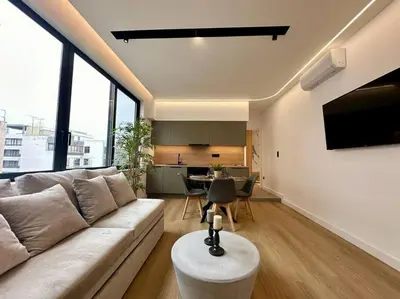 a living room with a couch and a table at BlueMotion - SensaBlu in Piraeus