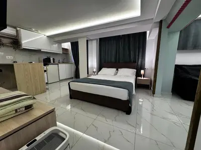 a large bedroom with a bed and a kitchen at Athens Stay 40 in Athens