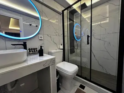 a bathroom with a toilet and a sink and a shower at Athens Stay 40 in Athens