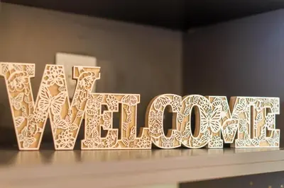 a wooden sign that says newleans sitting on a table at Aiolos GLYFADA luxury apartment in Athens