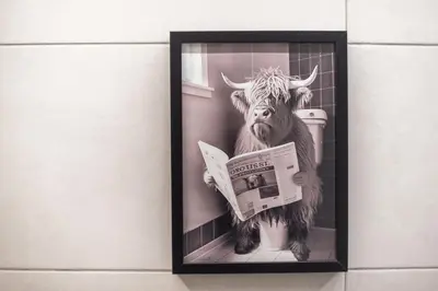 a picture of a cow and a newspaper at Golden Comfort With Courtyard By Greece Apartments in Athens