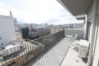 a balcony with a view of a city at Modern 7th-floor apartment with city view (FORM_G2) in Athens