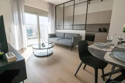 a living room with a couch and a table at Modern 7th-floor apartment with city view (FORM_G2) in Athens
