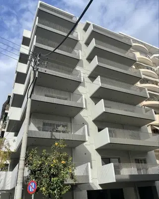 a building with balconies on the side of it at Modern 7th-floor apartment with city view (FORM_G2) in Athens