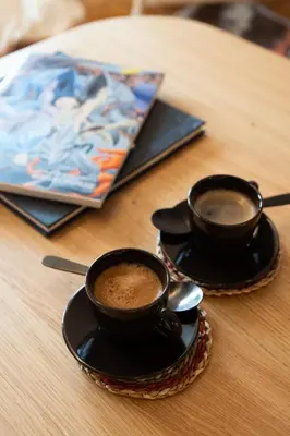 two cups of coffee sitting on a table at LIV - Modern Heavenly Retreat in Exarcheia in Athens