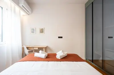a bedroom with a bed with towels on it at LIV - Modern Heavenly Retreat in Exarcheia in Athens