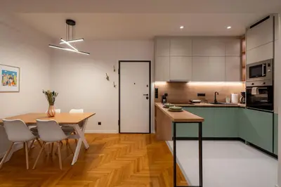 a kitchen and dining room with a table and chairs at LIV - Modern Heavenly Retreat in Exarcheia in Athens