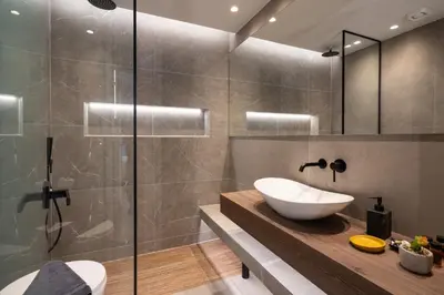 a bathroom with a sink and a shower at LIV - Modern Heavenly Retreat in Exarcheia in Athens