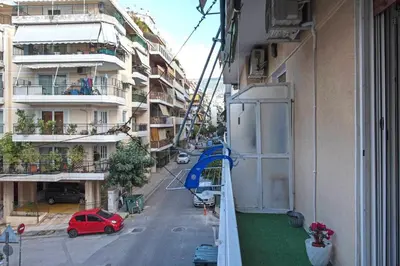 a view of a street from a balcony of a building at Minimal and cozy Home in Zografou in Athens