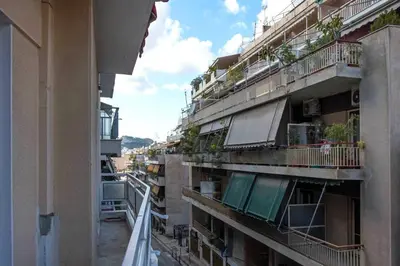 a view of an apartment building with balconies and plants at Minimal and cozy Home in Zografou in Athens