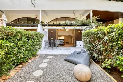 a house with a bag on the ground in the yard at The Four Seasons Vouliagmeni Escape in Athens