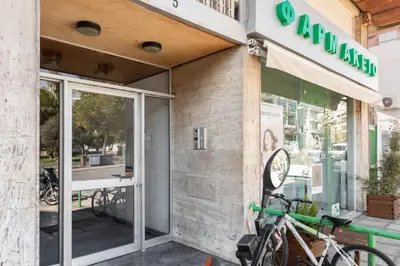 a store front with a bike parked outside of it at Exclusive 2BR Apartment in Alimos by UPSTREET in Athens