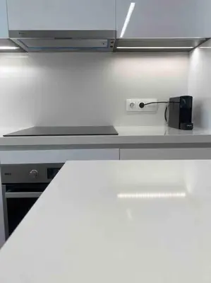 a white counter top with a black appliance on it at 130m Luxury apartment in the heart of Athens in Athens