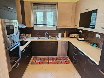 a kitchen with a sink and a stove top oven at Zoe's home - stunning view in Áyios Konstandínos