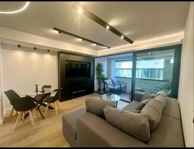 a living room with a couch and a table at BlueMotion -PortStay N1 in Piraeus