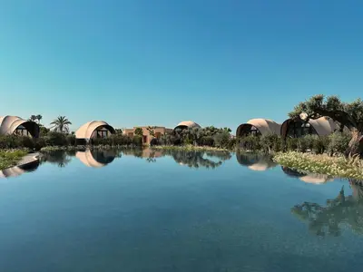a view of a lake with a group of tents at 91 Athens Riviera, The Resort in Athens