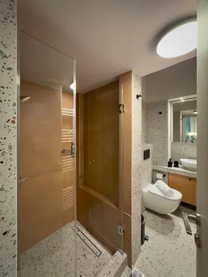 a bathroom with a shower with a toilet and a sink at Luxury Studio with Panoramic Views in Athens