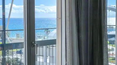 a view of the ocean from a hotel window at Alimos Sea View Family Apartment in Athens