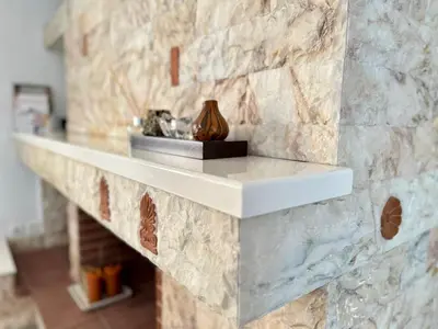 a stone wall with a shelf on it at Glyfada Grand Residence in Athens