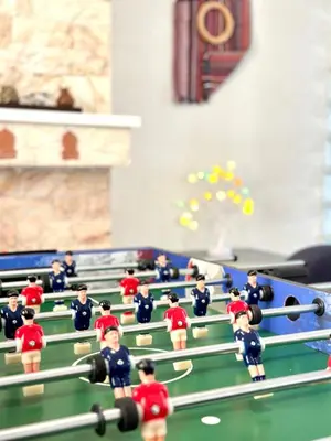 a group of toy dolls playing a game of snooker at Glyfada Grand Residence in Athens